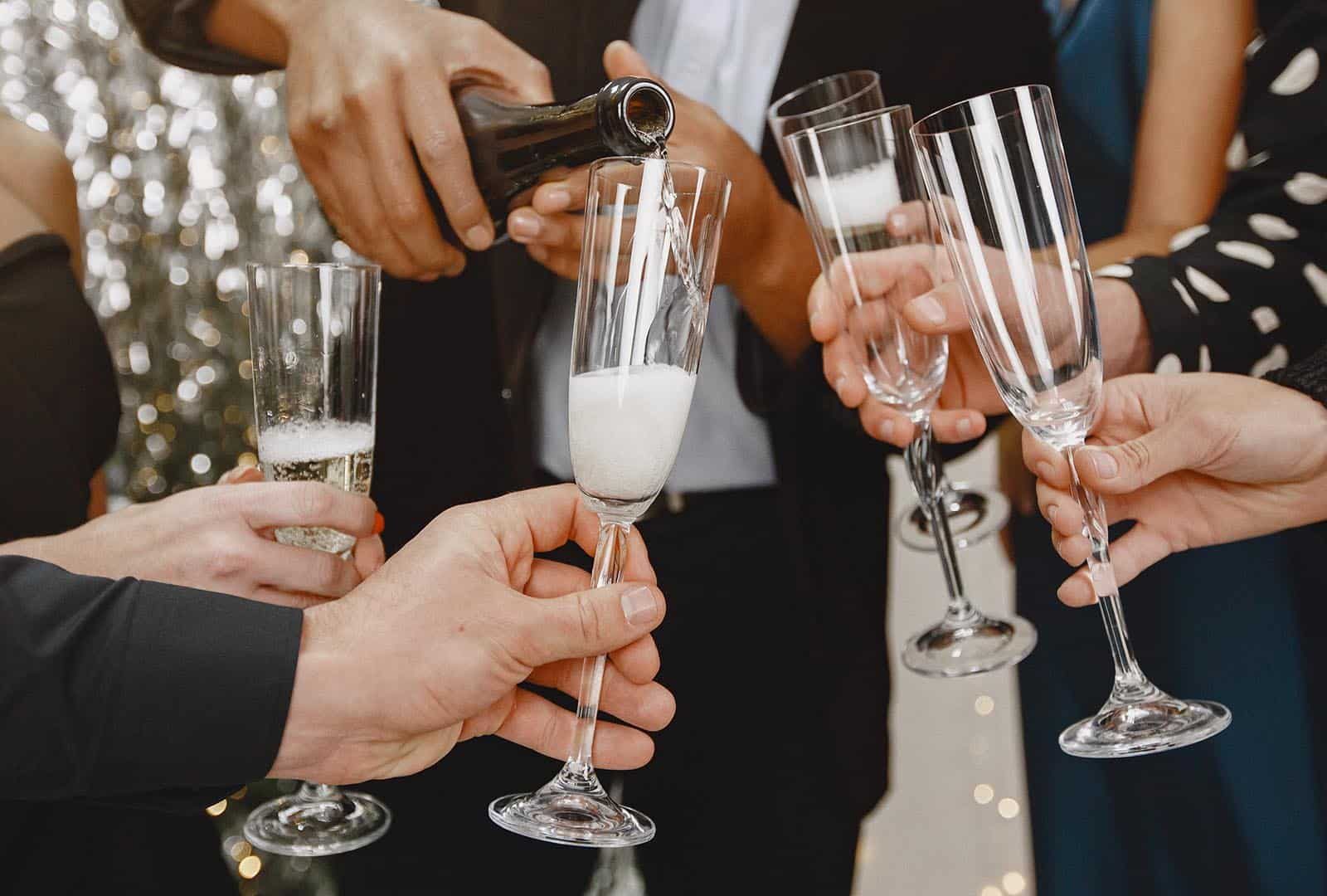 group-young-people-celebrating-new-year-friends-drinks-champagne